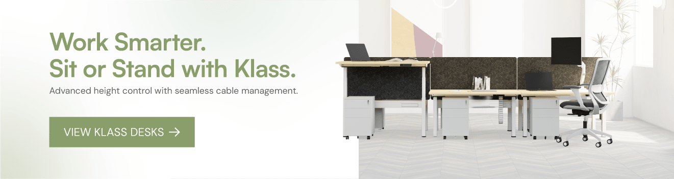 Modern office desk setup with height-adjustable desks and chairs, featuring text about Klass office furniture.